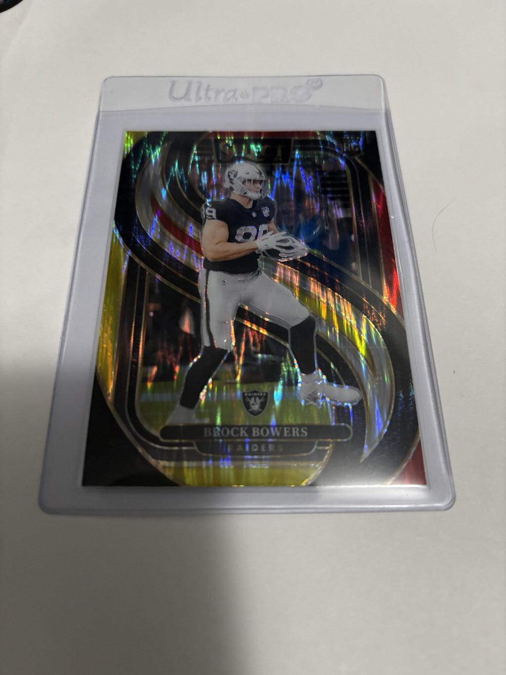 2024 Panini Select Brock Bowers RC #118 Premier Level Green Yellow Shock Prizm