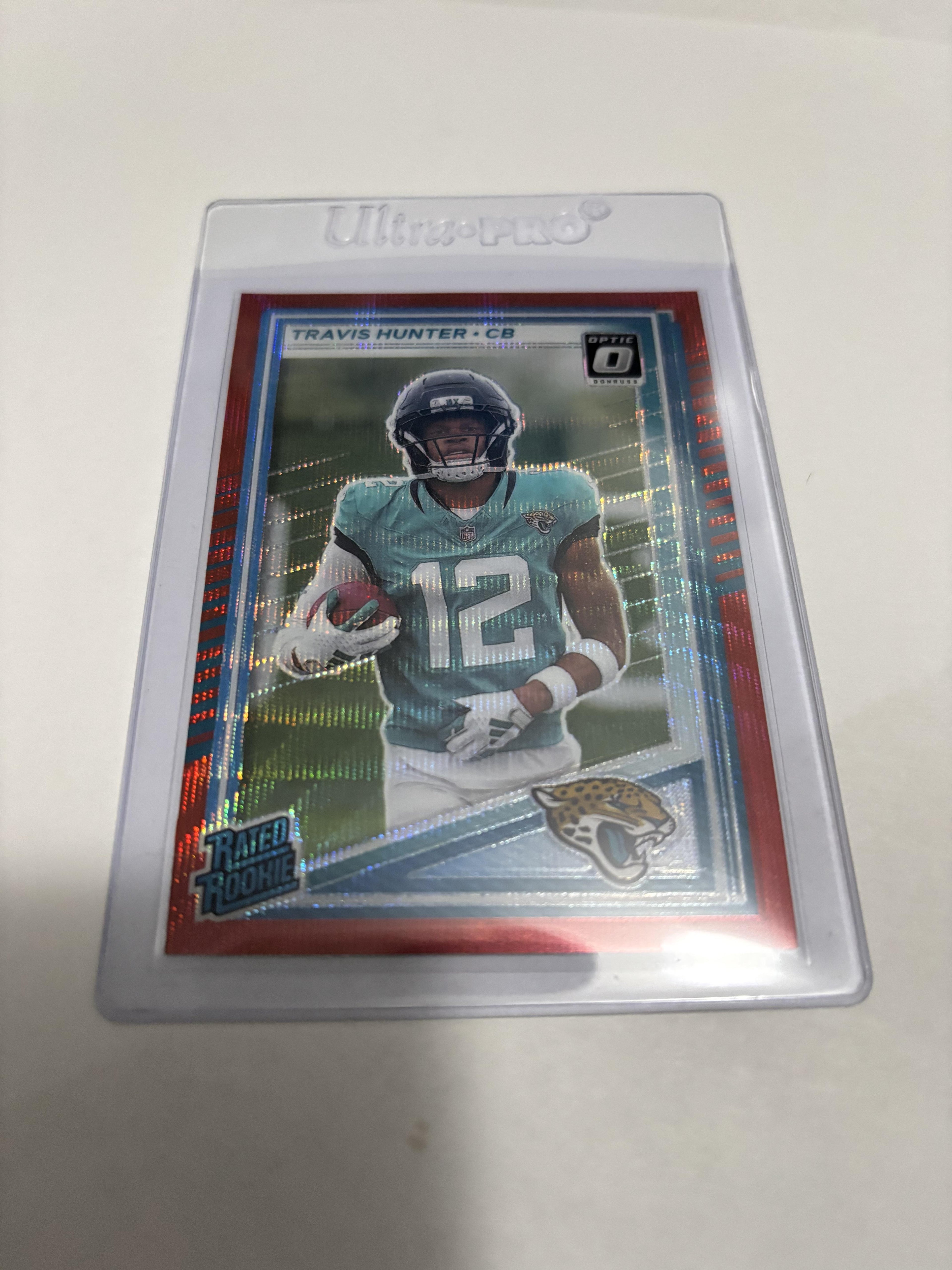 2025 Donruss Optic Travis Hunter Rated Rookie Red Velocity Prizm #301 RC Jags