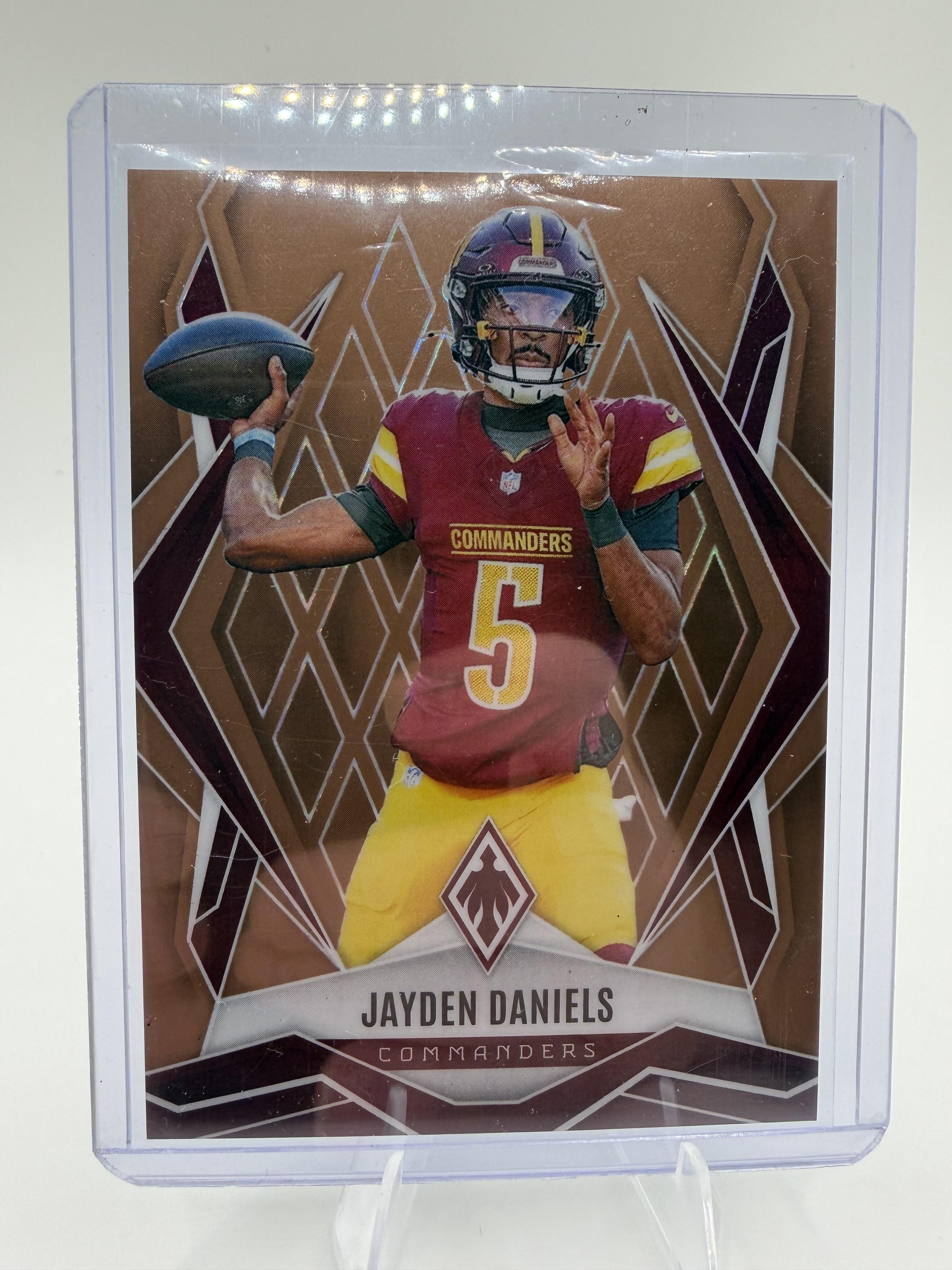 2025 Panini Phoenix Jayden Daniels #8 Bronze Winter Prizm Card /50 Commanders