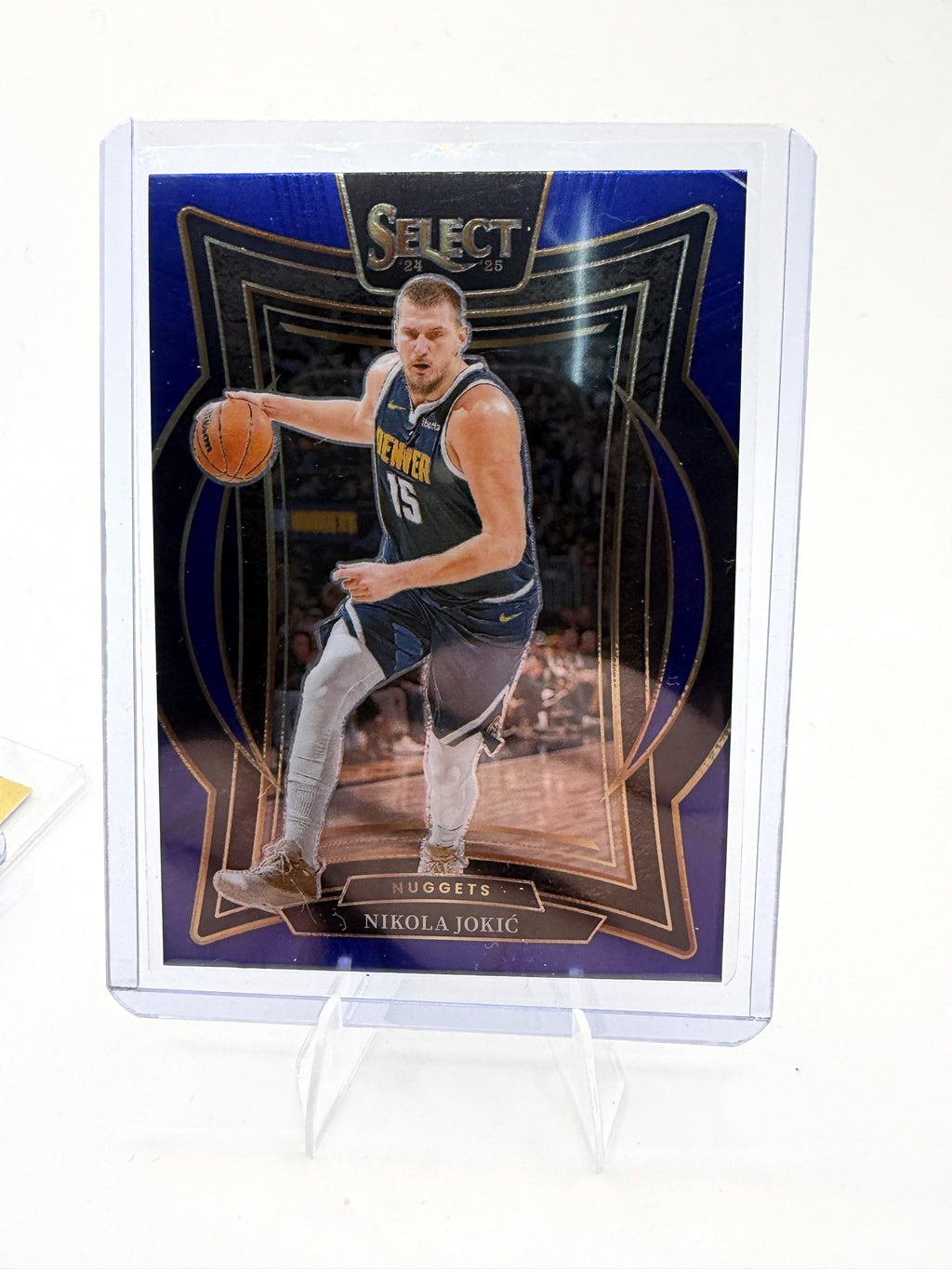 2024-25 Panini Select Nikola Jokić Blue Prizm Premier Level #140 Nugget